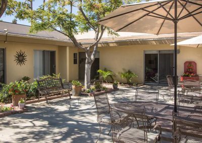 Courtyard with tables, chairs, and umbrellas